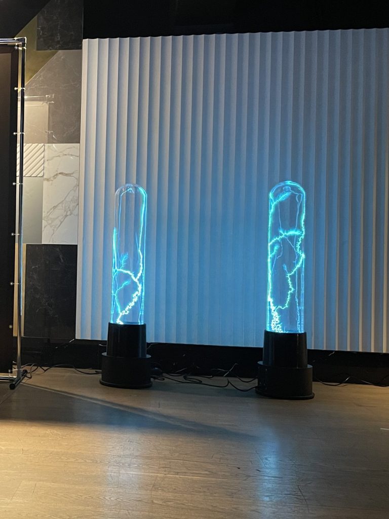 Two Blue Net plasma columns at a product launch in normal light