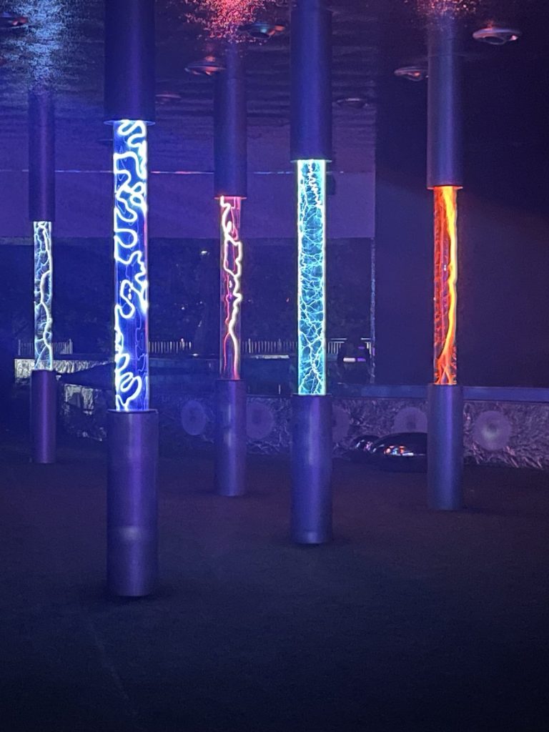 The Summer in Moscow hall: floor-to-ceiling columns turned into plasma tubes