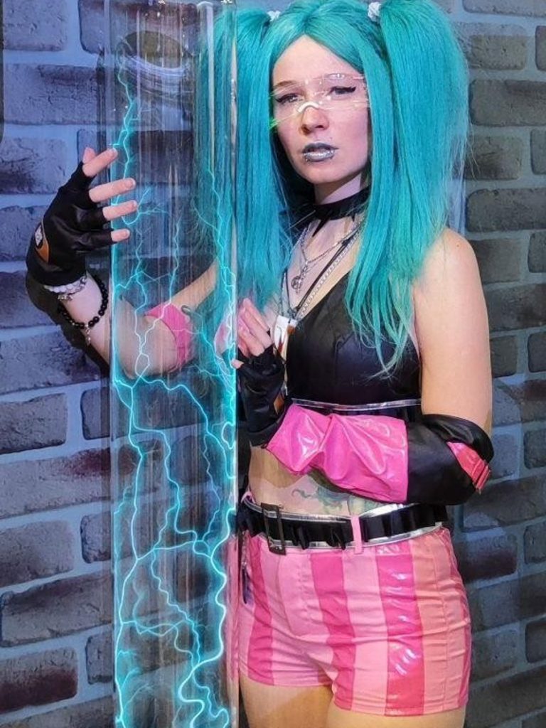 A costumed model with a plasma column at the Aris stand